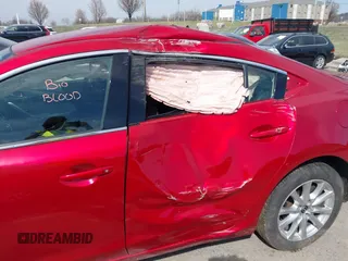 2016 Mazda 6 i Sport with VIN JM1GJ1U53G1409105, listed as a IAAI auction lot 41828135 with 136,812 mi miles and . Bid and sale history available at DreamBid. Image 6.