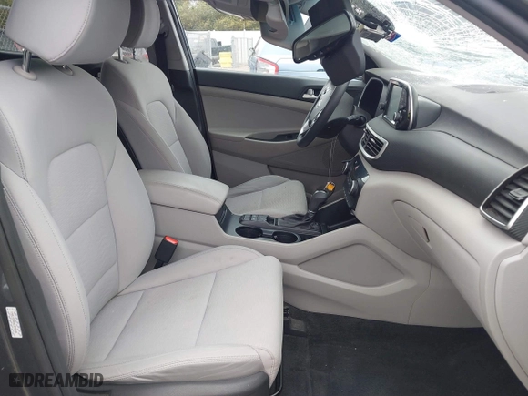 2019 Hyundai Tucson Value with VIN KM8J33A40KU999340, listed as a IAAI auction lot 41876380 with 52,752 mi miles. Bid and sale history available at carsss.com. Image 5.