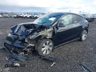 2022 Tesla Model Y Long Range z VIN 7SAYGDEE4NF447985, wystawiony jako IAAI lot #41811782 z przebiegiem 81 973 mil mil oraz . Historia ofert i sprzedaży dostępna na DreamBid. Obrazek 2.