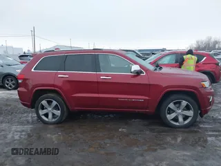 2014 Jeep Grand Cherokee Overland with VIN 1C4RJFCG9EC299235, listed as a IAAI auction lot 41670065 with 108,589 mi miles and . Bid and sale history available at DreamBid. Image 13.