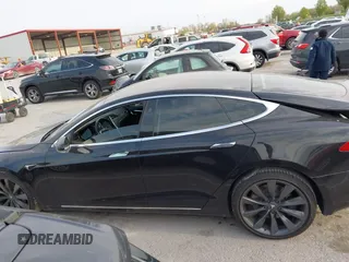 2017 Tesla Model S 100D with VIN 5YJSA1E28HF188981, listed as a IAAI auction lot 42010115 with 76,327 mi miles and . Bid and sale history available at DreamBid. Image 14.