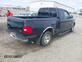 2000 Ford F-150 XL with VIN 1FTZX0725YKA09559, listed as a IAAI auction lot 41810954 with Not provided miles and . Bid and sale history available at DreamBid. Image 4.