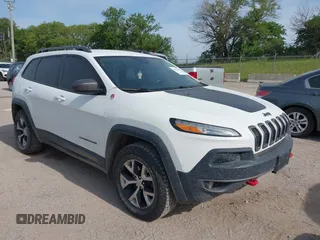 2015 Jeep Cherokee Trailhawk with VIN 1C4PJMBS6FW687718, listed as a IAAI auction lot 42505169 with 122,526 mi miles and . Bid and sale history available at DreamBid. Image 1.