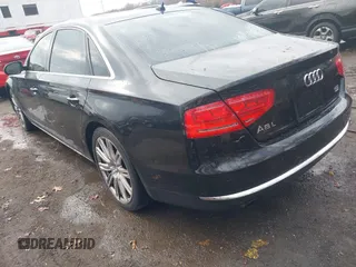 2012 Audi A8 L with VIN WAURVAFD8CN006917, listed as a IAAI auction lot 40877090 with 144,387 mi miles. Bid and sale history available at carsss.com. Image 3.