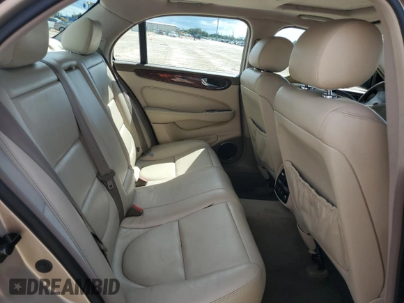 2004 Jaguar XJ with VIN SAJWA71C24SG28164, listed as a Copart auction lot 73968134 with 0 mi miles and Salvage Title. Bid and sale history available at carsss.com. Image 10.