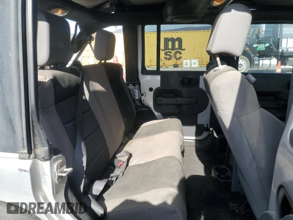 2007 Jeep Wrangler Unlimited X with VIN 1J8GB39157L142982, listed as a Copart auction lot 82050134 with 72,666 mi miles and Salvage Title. Bid and sale history available at DreamBid. Image 10.