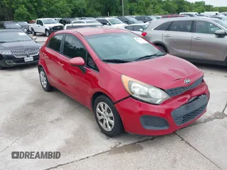 2015 Kia Rio LX with VIN KNADM5A34F6517123, listed as a IAAI auction lot 42125593 with 138,214 mi miles. Bid and sale history available at carsss.com. Image 1.