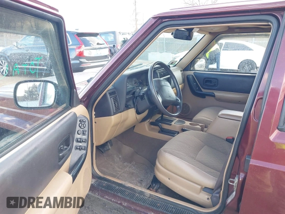 2000 Jeep Cherokee Classic with VIN 1J4FF58S7YL122676, listed as a IAAI auction lot 41710310 with 124,758 mi miles. Bid and sale history available at carsss.com. Image 5.