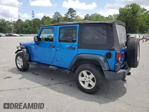 2015 Jeep Wrangler Unlimited Willys Wheeler with VIN 1C4BJWDG4FL611656, listed as a Copart auction lot 54010395 with 129,797 mi miles and Salvage Title. Bid and sale history available at DreamBid. Image 2.