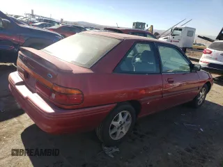 1996 Ford Escort z VIN 1FASP11J0TW138176, wystawiony jako Copart lot #82435494 z przebiegiem 62 107 mil mil oraz Czysty tytuł • Clean title. Historia ofert i sprzedaży dostępna na DreamBid. Obrazek 3.