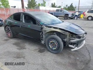 2019 Tesla Model 3 Mid Range with VIN 5YJ3E1EA3KF415601, listed as a IAAI auction lot 42125393 with 150,220 mi miles. Bid and sale history available at carsss.com. Image 1.