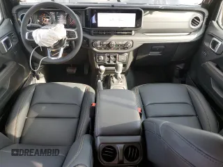 2024 Jeep Wrangler Sahara with VIN 1C4PJXEG8RW262661, listed as a Copart auction lot 55464325 with 561 mi miles and Salvage title. Bid and sale history available at DreamBid. Image 8.