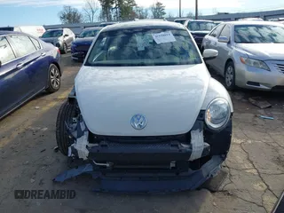 2014 Volkswagen Beetle 2.5L w/Sun with VIN 3VWJP7ATXEM628666, listed as a IAAI auction lot 41328014 with 70,990 mi miles and . Bid and sale history available at DreamBid. Image 13.