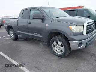 2011 Toyota Tundra with VIN 5TFUY5F10BX177455, listed as a IAAI auction lot 41552082 with 282,337 mi miles and . Bid and sale history available at DreamBid. Image 1.