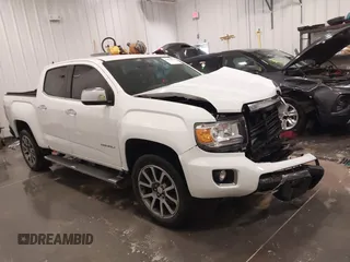2018 GMC Canyon 4WD Denali z VIN 1GTG6EEN1J1101655, wystawiony jako IAAI lot #42074956 z przebiegiem 93 636 mil mil oraz . Historia ofert i sprzedaży dostępna na DreamBid. Obrazek 1.