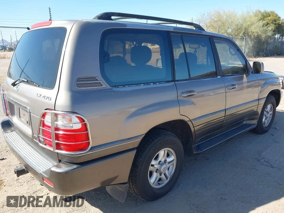 2000 Lexus LX 470 with VIN JT6HT00WXY0079873, listed as a IAAI auction lot 41605770 with 302,758 mi miles and . Bid and sale history available at DreamBid. Image 4.