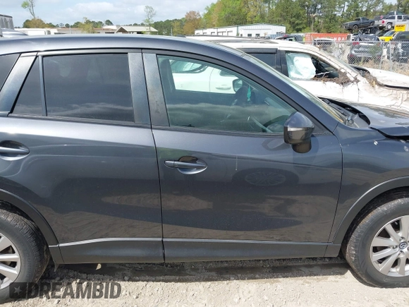 2016 Mazda CX-5 Touring with VIN JM3KE2CYXG0647921, listed as a IAAI auction lot 41948068 with 133,733 mi miles and . Bid and sale history available at DreamBid. Image 13.