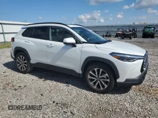 2023 Toyota Corolla Cross XLE with VIN 7MUDAAAG5PV068355, listed as a Copart auction lot 58121795 with 25,667 mi miles and Salvage title. Bid and sale history available at DreamBid. Image 4.