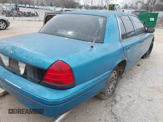 2000 Ford Crown Victoria Police Police Interceptor with VIN 2FAFP71W4YX136846, listed as a IAAI auction lot 41715363 with 335,956 mi miles. Bid and sale history available at carsss.com. Image 4.