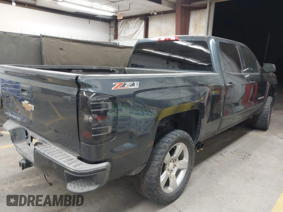 2017 Chevrolet Silverado 1500 LT with VIN 1GCUKREC4HF179560, listed as a IAAI auction lot 41460202 with 136,675 mi miles and . Bid and sale history available at DreamBid. Image 4.