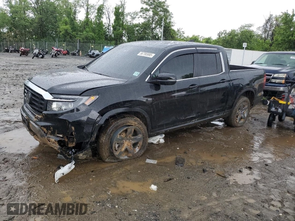 2023 Honda Ridgeline RTL with VIN 5FPYK3F51PB067811, listed as a Copart auction lot 56795995 with 21,500 mi miles and Salvage title. Bid and sale history available at DreamBid. Image 1.