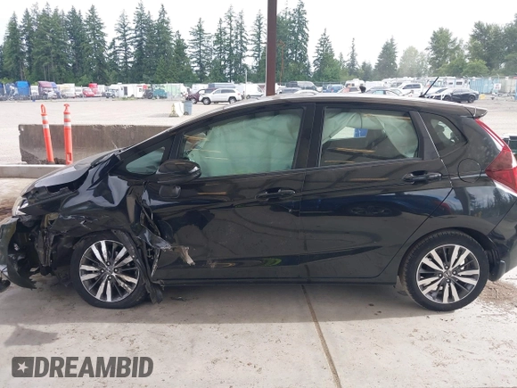 2015 Honda Fit EX-L z VIN 3HGGK5H81FM701122, wystawiony jako IAAI lot #42610165 z przebiegiem 74 969 mil mil oraz . Historia ofert i sprzedaży dostępna na DreamBid. Obrazek 15.