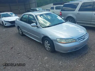 2002 Honda Accord EX z VIN 1HGCG56622A013090, wystawiony jako IAAI lot #42132291 z przebiegiem 152 567 mil mil oraz . Historia ofert i sprzedaży dostępna na DreamBid. Obrazek 1.