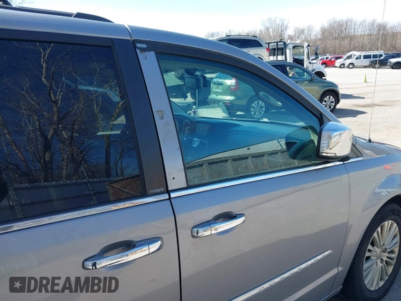2013 Chrysler Town & Country Touring L with VIN 2C4RC1CG6DR660858, listed as a IAAI auction lot 41970976 with 140,299 mi miles and . Bid and sale history available at DreamBid. Image 20.