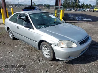 1999 Honda Civic HX with VIN 1HGEJ7122XL020224, listed as a IAAI auction lot 41723460 with 202,759 mi miles. Bid and sale history available at carsss.com. Image 1.