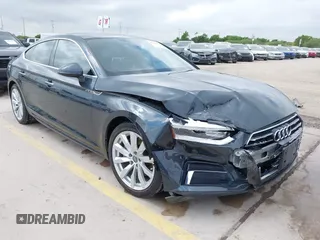 2018 Audi A5 Sportback Premium z VIN WAUANCF5XJA022221, wystawiony jako IAAI lot #42041410 z przebiegiem 94 851 mil mil oraz . Historia ofert i sprzedaży dostępna na DreamBid. Obrazek 1.