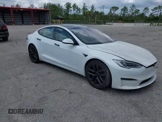 2022 Tesla Model S Plaid with VIN 5YJSA1E61NF460155, listed as a IAAI auction lot 42545167 with 51,711 mi miles and . Bid and sale history available at DreamBid. Image 1.