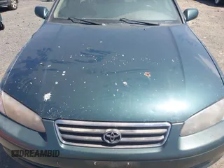 2000 Toyota Camry CE z VIN 4T1BG28K9YU968930, wystawiony jako IAAI lot #42310350 z przebiegiem 190 762 mil mil oraz . Historia ofert i sprzedaży dostępna na DreamBid. Obrazek 12.