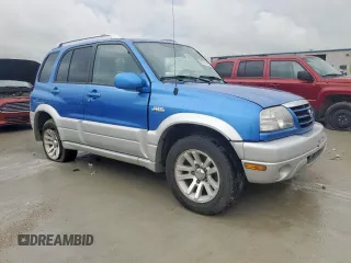 2005 Suzuki Grand Vitara LX with VIN JS3TD62V354200952, listed as a Copart auction lot 60374465 with 134,957 mi miles and Salvage title. Bid and sale history available at DreamBid. Image 4.