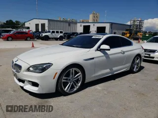 2012 BMW 6 Series 650i with VIN WBALX3C59CC528427, listed as a Copart auction lot 71097654 with 96,036 mi miles and Salvage Title. Bid and sale history available at carsss.com. Image 1.