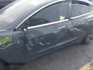 2019 Tesla Model 3 Mid Range with VIN 5YJ3E1EA3KF426971, listed as a IAAI auction lot 41564939 with Not Provided miles and . Bid and sale history available at carsss.com. Image 6.