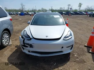 2020 Tesla Model 3 Standard Range Plus with VIN 5YJ3E1EA3LF785951, listed as a IAAI auction lot 41919339 with 63,025 mi miles and . Bid and sale history available at carsss.com. Image 11.