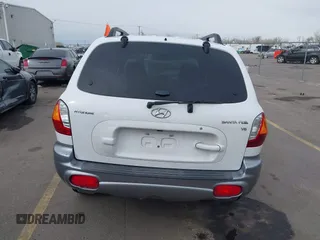2004 Hyundai Santa Fe GLS with VIN KM8SC13DX4U609921, listed as a IAAI auction lot 41619492 with 113,592 mi miles. Bid and sale history available at carsss.com. Image 16.