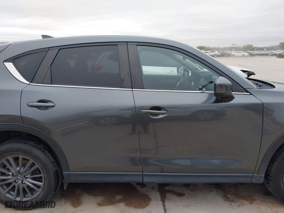 2021 Mazda CX-5 Touring with VIN JM3KFBCM0M0342210, listed as a IAAI auction lot 41236013 with 96,012 mi miles. Bid and sale history available at carsss.com. Image 14.