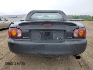 1999 Mazda MX-5 Miata with VIN JM1NB3531X0102616, listed as a Copart auction lot 59779415 with 194,494 mi miles and Salvage title. Bid and sale history available at DreamBid. Image 6.