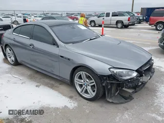 2015 BMW 6 Series 640i xDrive with VIN WBA6B8C51FD453634, listed as a IAAI auction lot 41382738 with 90,240 mi miles and . Bid and sale history available at carsss.com. Image 1.