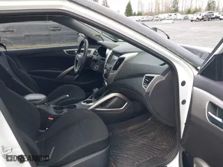 2015 Hyundai Veloster with VIN KMHTC6AD6FU236478, listed as a IAAI auction lot 41923285 with 120,079 mi miles. Bid and sale history available at carsss.com. Image 5.