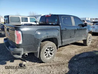 2021 GMC Canyon 4WD AT4 w/Leather with VIN 1GTG6FEN3M1274409, listed as a Copart auction lot 42502355 with 57,194 mi miles and Salvage Title. Bid and sale history available at carsss.com. Image 3.