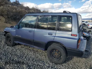 1995 Suzuki Sidekick JX z VIN 2S3TD03V5S6403069, wystawiony jako Copart lot #80273204 z przebiegiem Nie podano mil oraz Szkody całkowita. Historia ofert i sprzedaży dostępna na DreamBid. Obrazek 2.