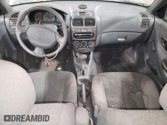2000 Hyundai Accent z VIN KMHCG45G4YU090520, wystawiony jako Copart lot #79705864 z przebiegiem 145 490 mil mil oraz Szkoda całkowita • Salvage title. Historia ofert i sprzedaży dostępna na DreamBid. Obrazek 8.