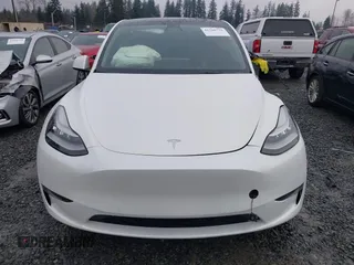 2022 Tesla Model Y Long Range z VIN 7SAYGDEE6NF451259, wystawiony jako IAAI lot #41200775 z przebiegiem 59 683 mil mil oraz . Historia ofert i sprzedaży dostępna na DreamBid. Obrazek 13.