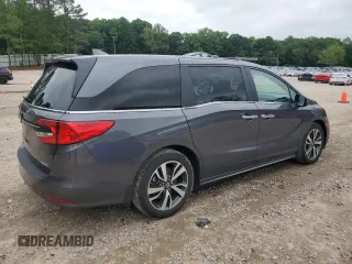 2023 Honda Odyssey Touring with VIN 5FNRL6H86PB024066, listed as a Copart auction lot 58414575 with 29,827 mi miles and Salvage title. Bid and sale history available at DreamBid. Image 3.