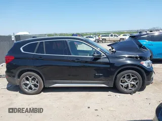 2017 BMW X1 sDrive28i z VIN WBXHU7C31H5H33748, wystawiony jako IAAI lot #42003198 z przebiegiem 71 274 mil mil oraz . Historia ofert i sprzedaży dostępna na DreamBid. Obrazek 13.
