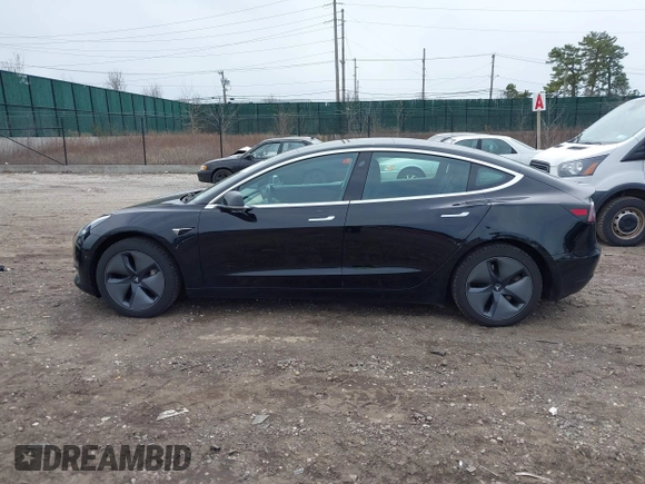 2019 Tesla Model 3 Mid Range with VIN 5YJ3E1EA2KF395549, listed as a IAAI auction lot 41895977 with 97,108 mi miles and . Bid and sale history available at carsss.com. Image 14.
