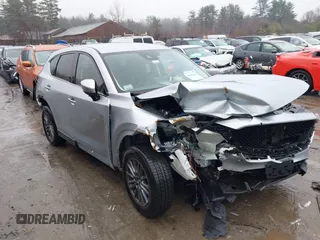 2021 Mazda CX-5 Touring z VIN JM3KFBCM3M0301019, wystawiony jako IAAI lot #41838547 z przebiegiem 46 716 mil mil oraz . Historia ofert i sprzedaży dostępna na DreamBid. Obrazek 1.