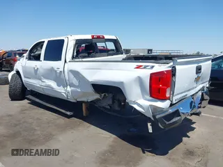 2015 Chevrolet Silverado 1500 LT with VIN 1GCUKREC5FF199331, listed as a IAAI auction lot 42111381 with 180,056 mi miles and . Bid and sale history available at DreamBid. Image 3.